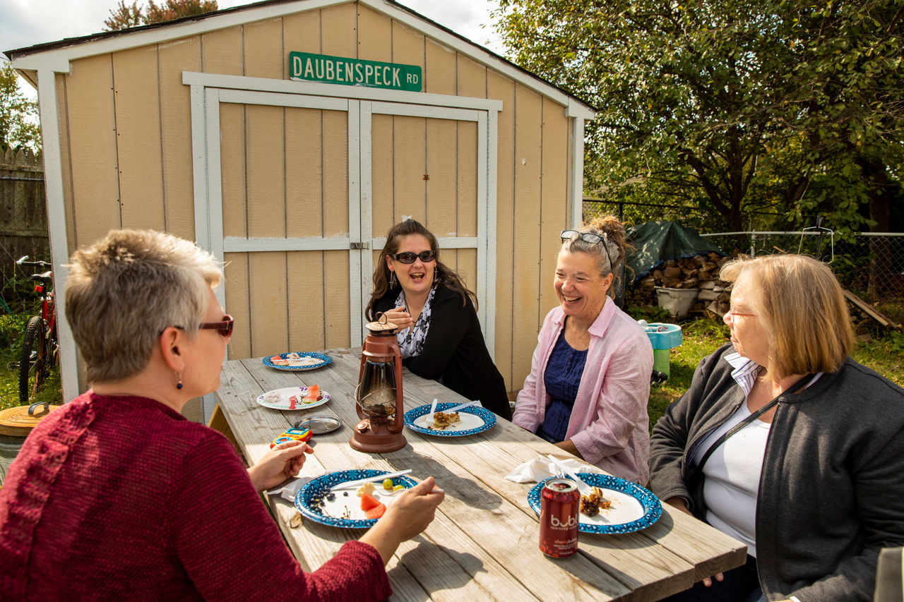 friends eat lunch together outside
