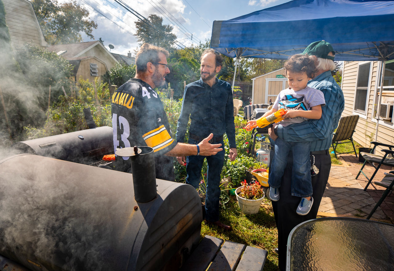 friends talk while grilling