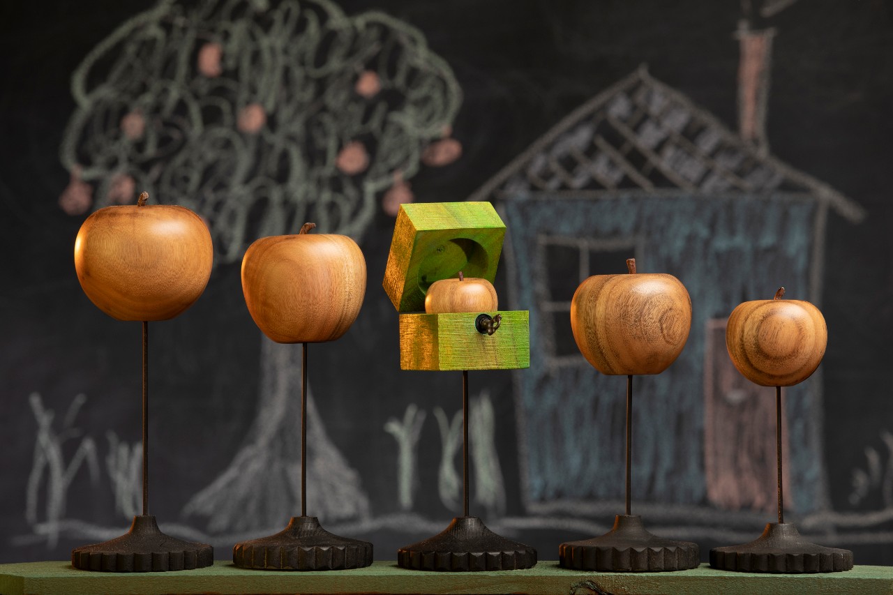 Wooden apples, worm, chalk drawings. 