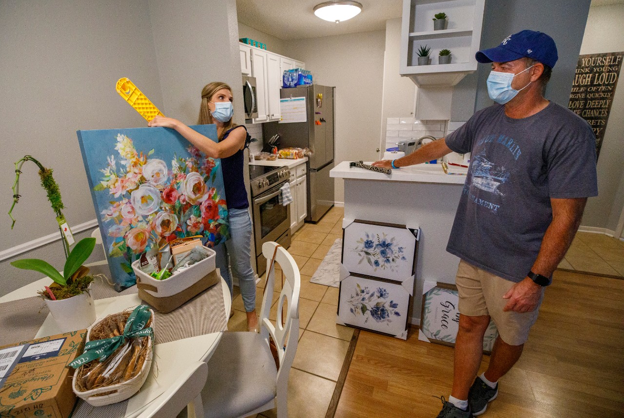 Jane Nodskov (story subject) left with father of one of the Houston Haven guests...hanging wall art