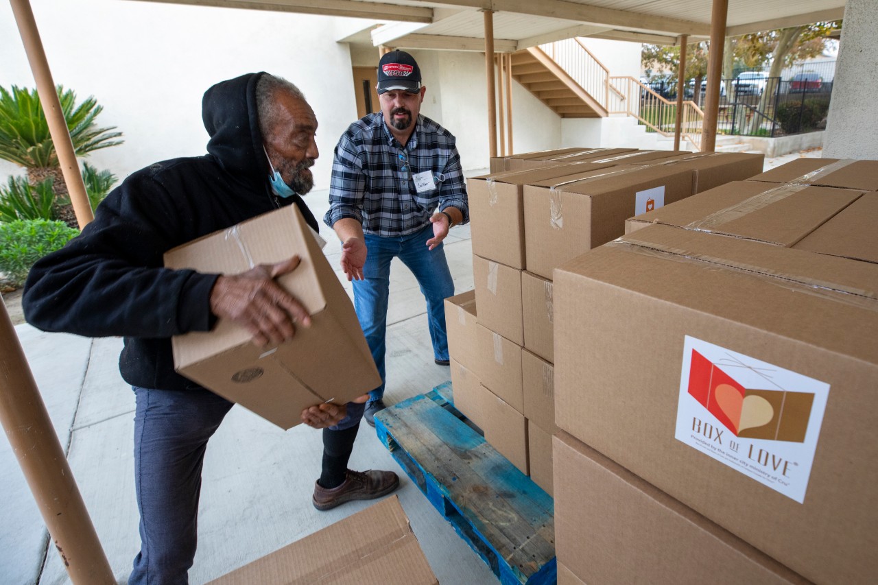 Volunteers from one of Cru® Inner City Bakersfield’s partner churches pick up Boxes of Love® for their food giveaway event.