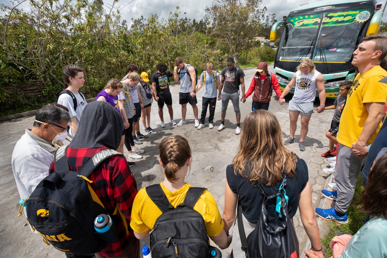 The Athletes in Action® group prays together in the highlands just before separating to give away water filters and start spiritual conversations.