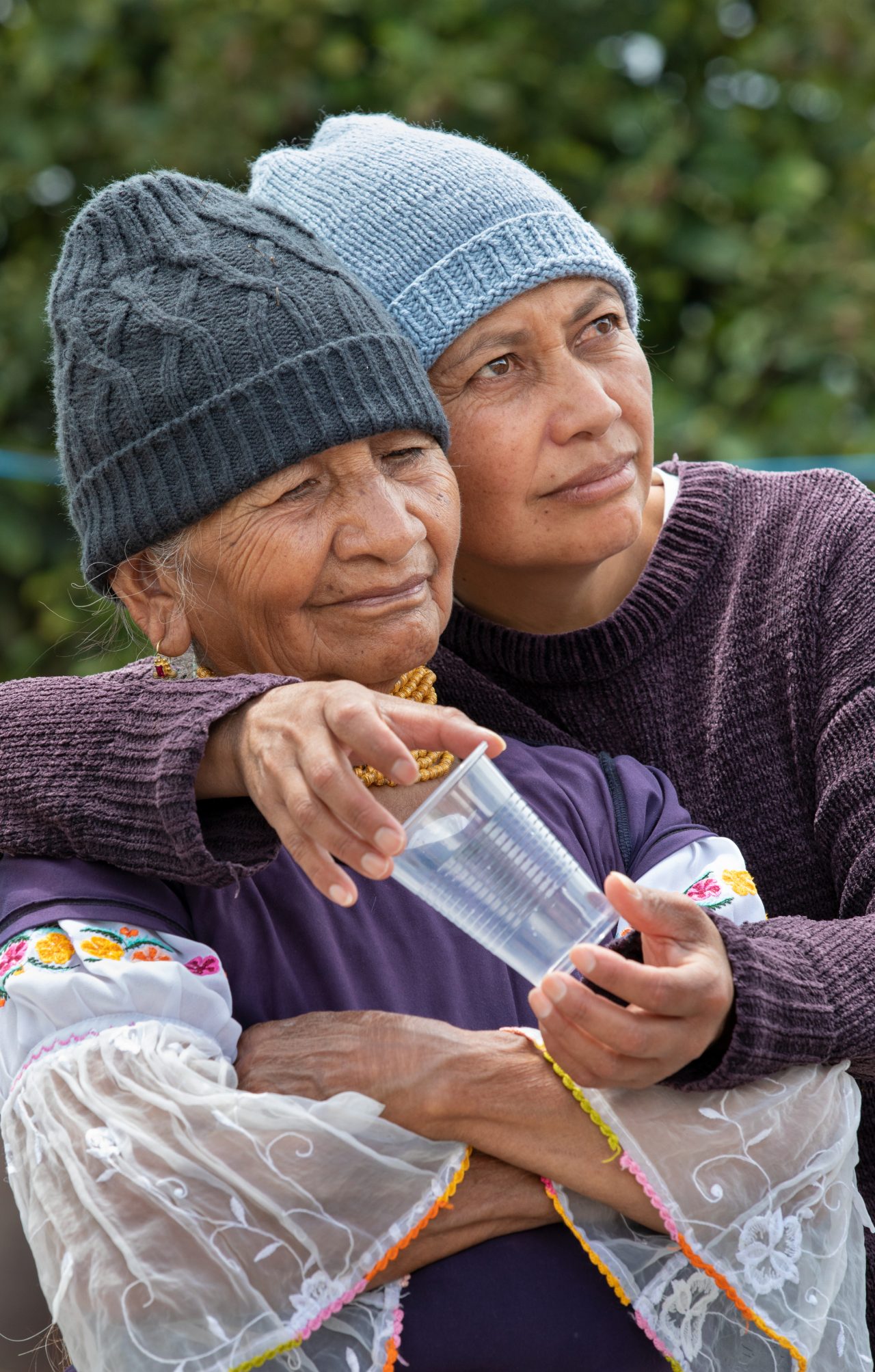Nancy Vinueza (right) and her 82-year-old mother, Maria, listen to Desmond communicate the gospel.