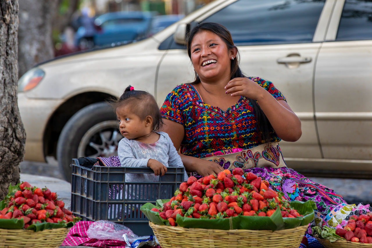 A strawberry farmer sells her wares in Central Park, Antigua’s town square.