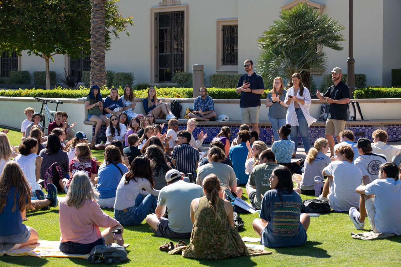 students and staff members gathered on campus for an all-mission meeting