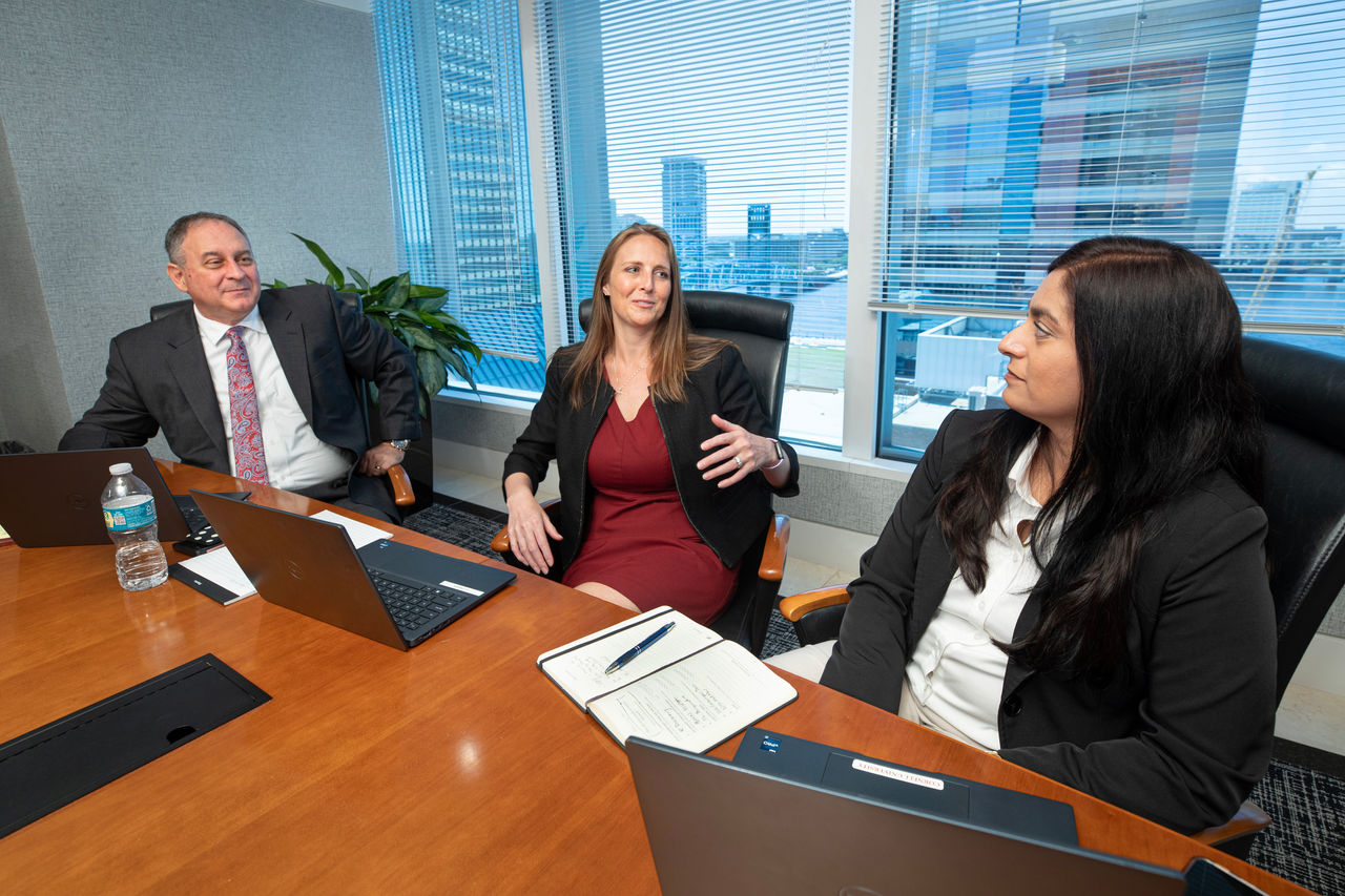Jennifer Vanover, attorney with FLAG ministry. Jen talking with Tom McThenia and Rupa Lloyd, attorneys she works with. 