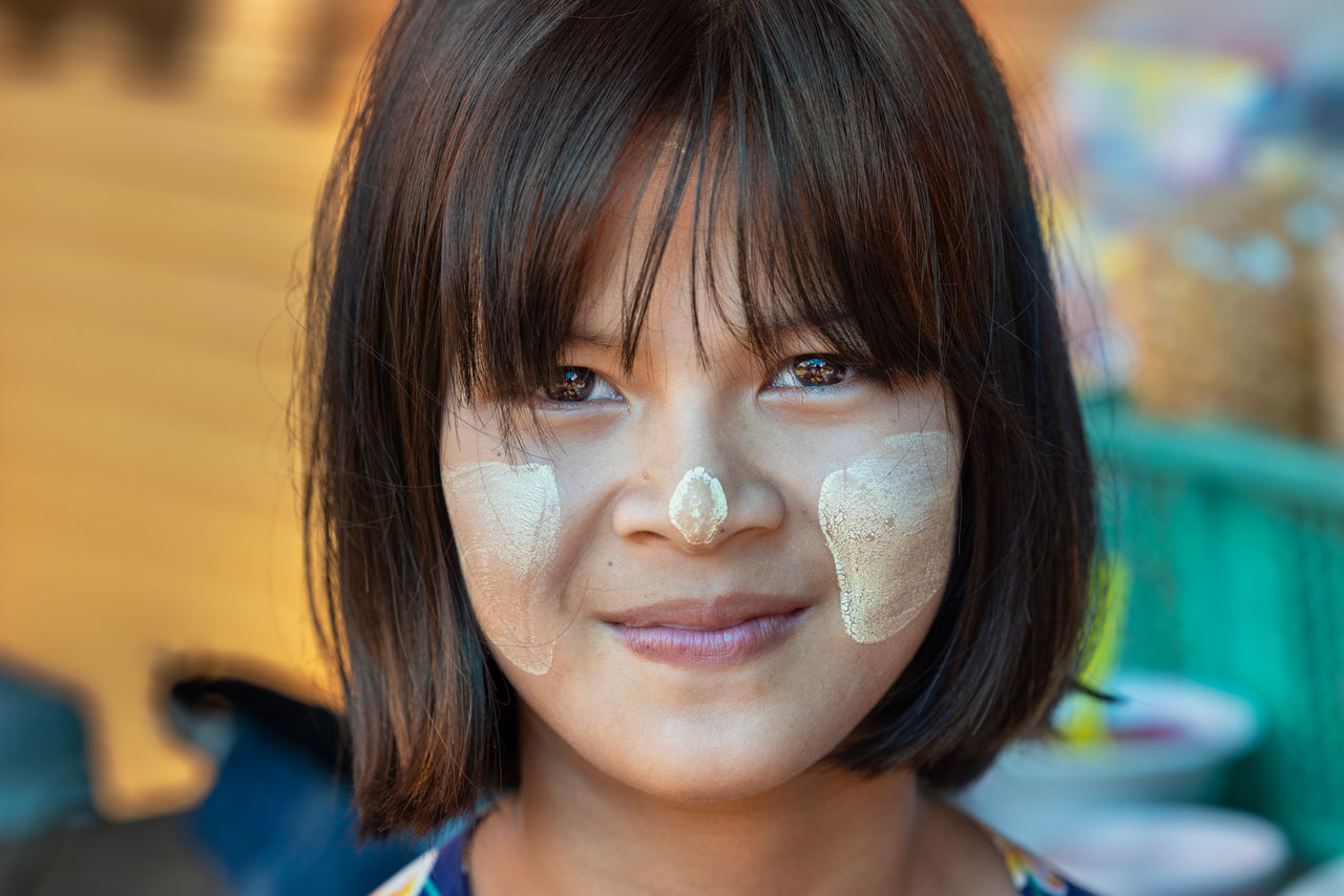 girl smiling with paste on face