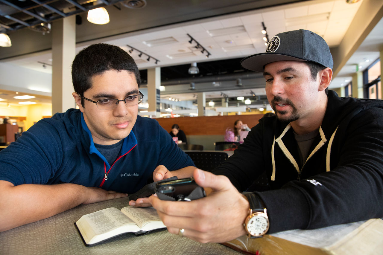Christian being discipled by Kenny Dyches.