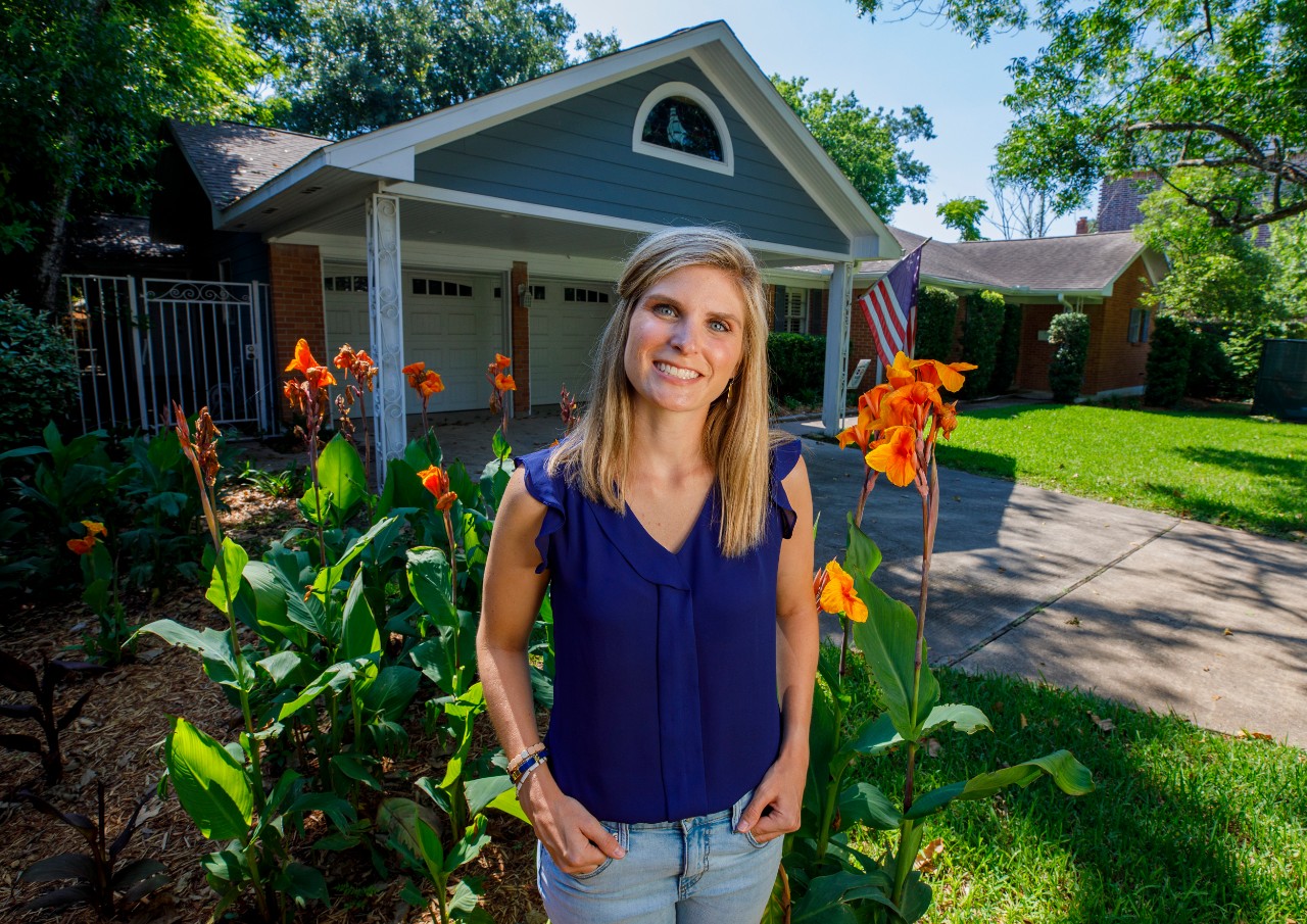 Jane Nodskov (story subject) in front of one of the Houson Haven homes
