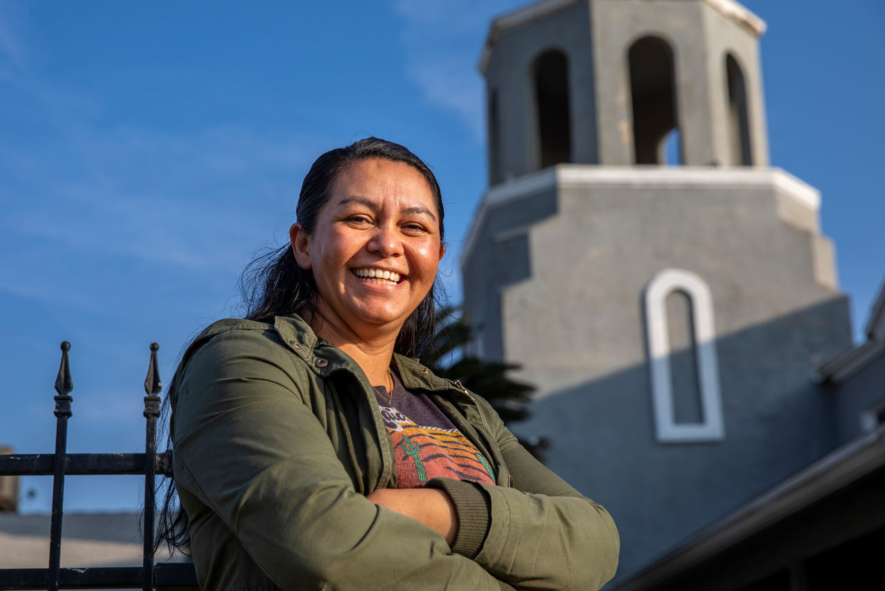 Rosanna Aguilar (story subject) in front of Centro Christiano Agape church 