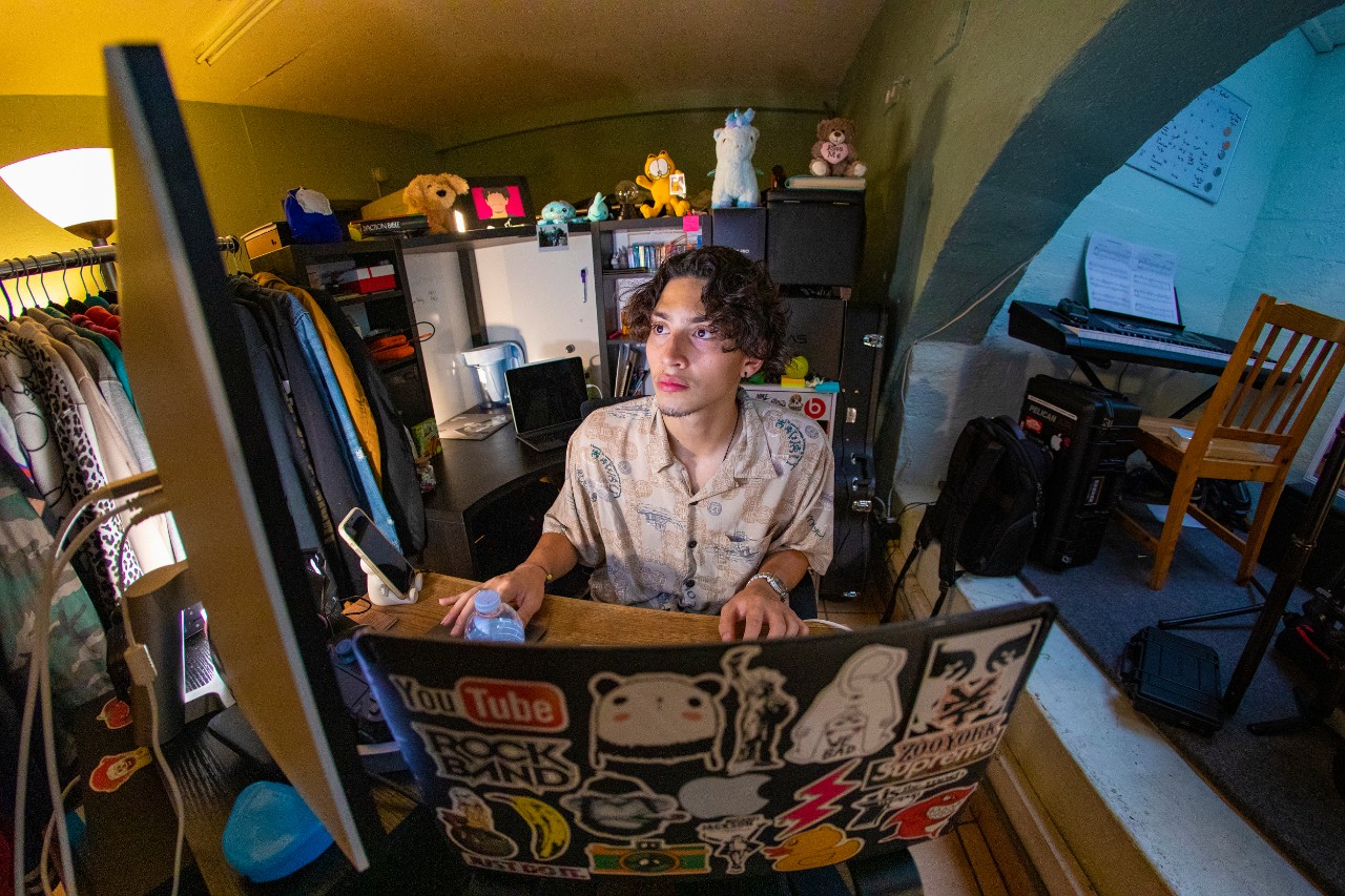 Nick Angarita works on a video project in his home