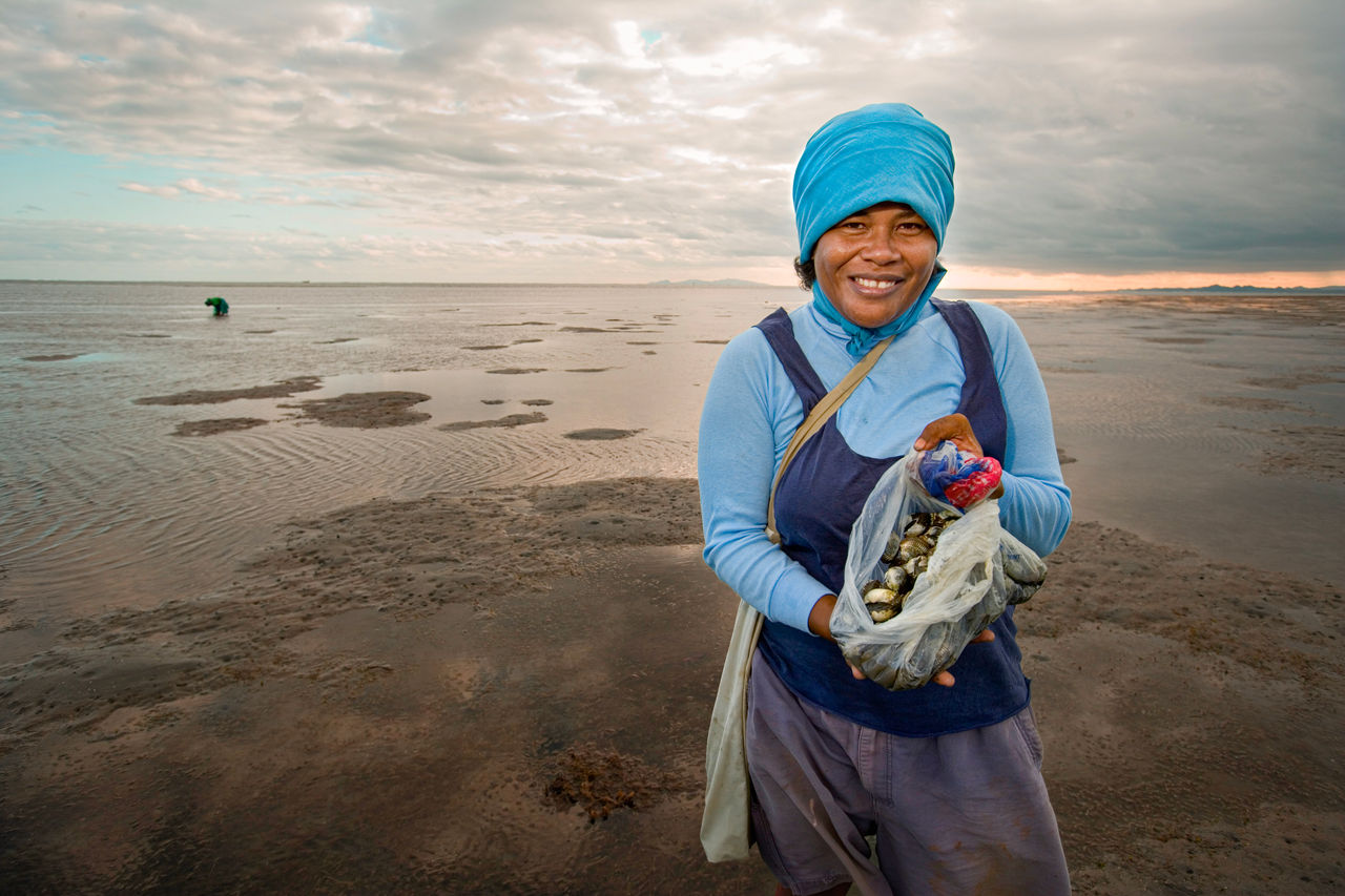These pictures are all taken in the capital city of Suva. The tides go way out leaving mud flats during low tide. This woman was digging clams on the flats.